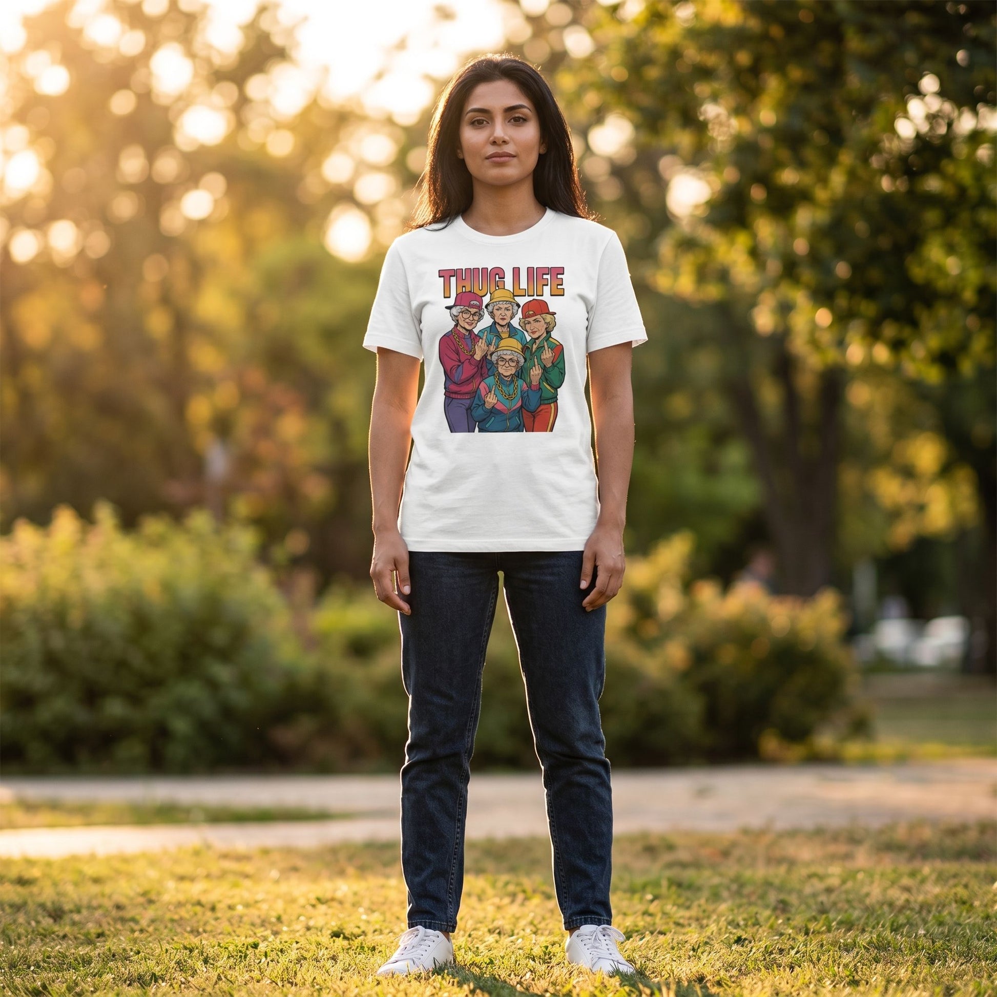 Model in park at golden hour wearing golden thug life T-shirt, capturing fit, fabric, and vibrant print.